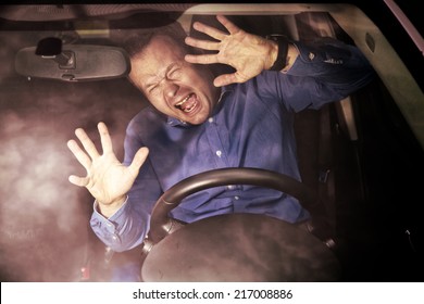 Man driver during moment of car accident inside of a car (hard grunge effect)