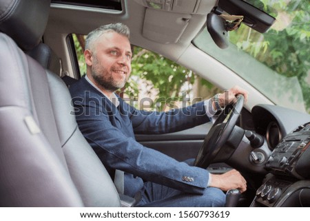 man driver sitting in the car and drive