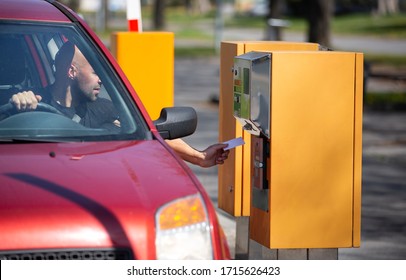 Man Driver Taking, Validate Ticket From The Vending Machine For Parking In Private Area