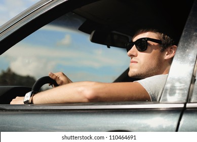 Man Driving A Car