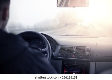 Man Driving A Car