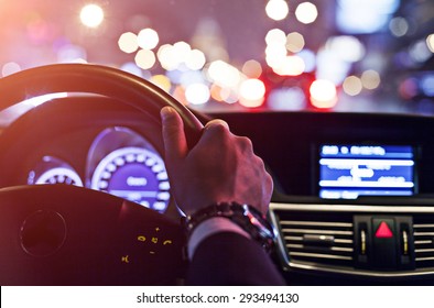 Man Driving A Car At Night