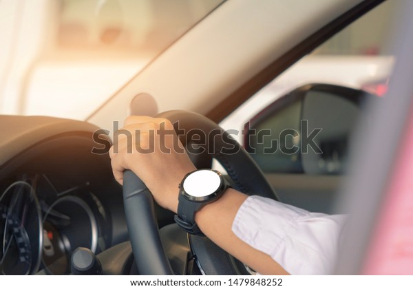 man driving car on blurred background in city.\
Using wallpaper for transport, automotive automobile and car for\
travel advertising image.