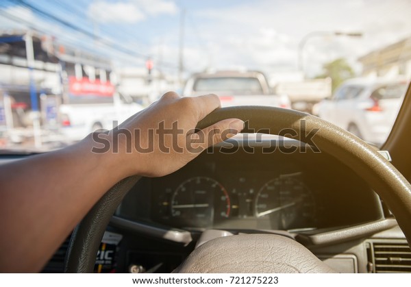 man driving\
car from rear view on the\
highway.