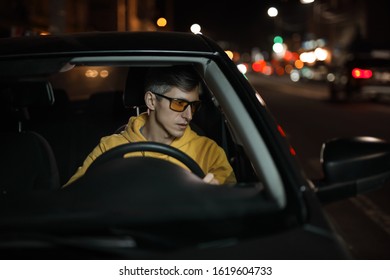 Man Driving Car In Special Yellow Eyeglasses At Night For Good Night Vision