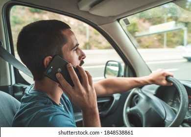 Man driving car while talking in the phone. Driving and texting smart phone. Danger distraction concept.