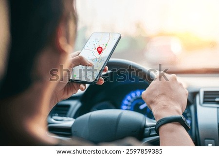 Man driving car while using GPS navigation app on smartphone, searching for directions with digital map, concept of travel.