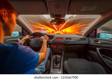 Man Driving Fast Into A Tunnel By Car At Night. Interior POV.