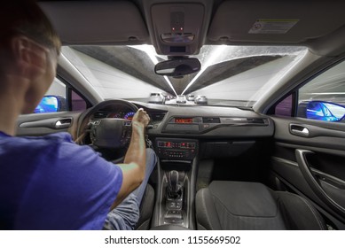 Man Driving Fast Into A Tunnel By Car At Night. Interior POV.