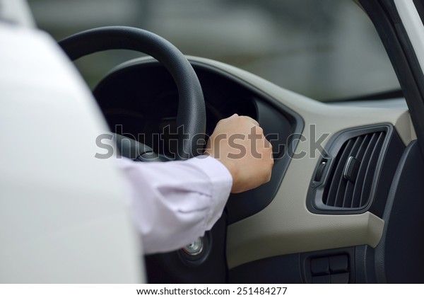 Man driving his\
car. Automotive concept\
photo