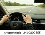 Man driving his car, closeup. Traffic rules