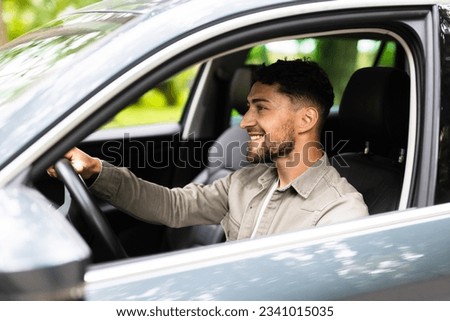 Man driving his car on way to work.