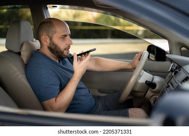 Man Driving His New Car Recording The Voice Message At Smartphone, Driver Using Voice Command Recorder On Mobile Phone