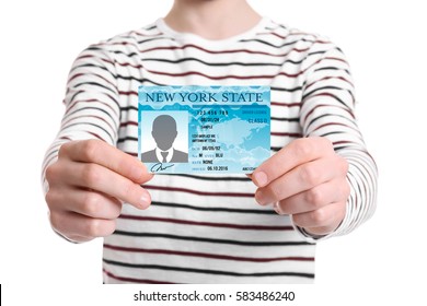Man with driving license on white background