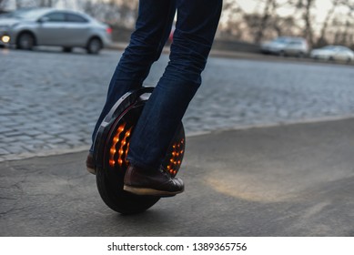 Man Driving On Monowheel Or Electric Unicycle