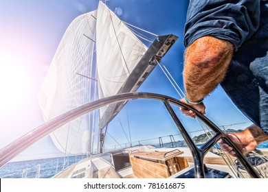 Man Driving Sailing Boat In Navigation