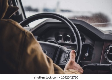 Man Driving A Truck In The Winter.