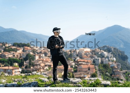 Man drone pilot with fpv drone. Virtual reality glasses for fly his high-speed racing drone.