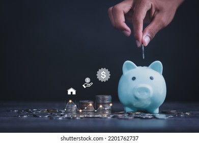 Man Drops Coins Into Cute Pig Piggy Bank, Enjoys Saving Coins At Home During Crisis Reduce Family Expenses Family Saving Money Concept Icon For Future Spending To Improve Quality Of Life