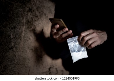 Man is drug dealer.  Man call up sells the drugs on phone and he is addicted drug or narcotic with copy space