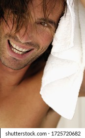 Man Drying Hair With Towel