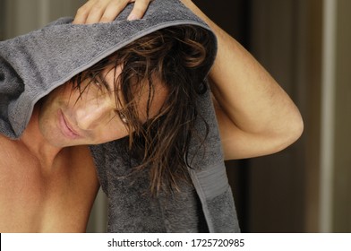 Man Drying Hair With Towel