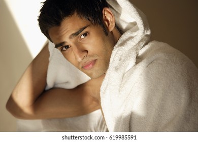 Man Drying Hair With Towel