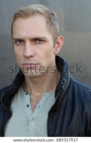 Man with dubious look close up