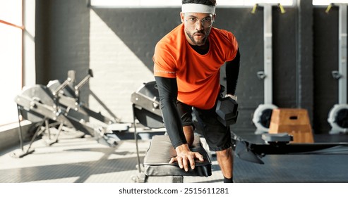 Man, dumbbell row and gym with workout for fitness, training and muscle development for health. Person, exercise and equipment for routine, balance and progress with bodybuilding at wellness club - Powered by Shutterstock