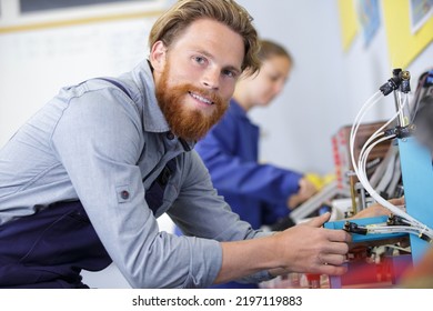 man during assembly of electronic components