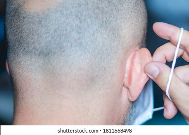 Man With Ear Skin Irritation From Wearing A Face Mask