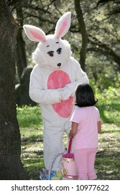 Man In A Easter Bunny Costume With A Little Girl