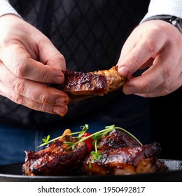 Man Eating Bbq Pork Ribs. 