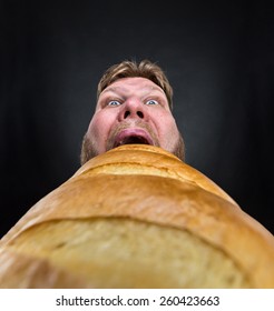 Man Eating A Big Bread