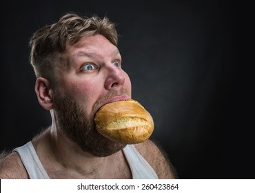 Man Eating A Big Bread