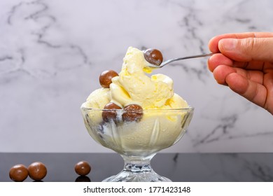 Man Eating Bowl Of Vanilla Flavor Ice Cream Sundae With Chocolate Candy