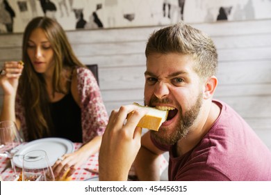 Man Eating Bread With Crazy Face