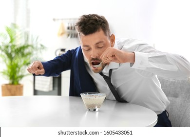 Man Eating Breakfast In Hurry At Home. Morning Preparations