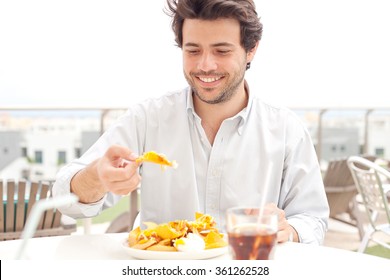 Man Eating Chips