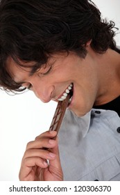 Man Eating Chocolate Bar