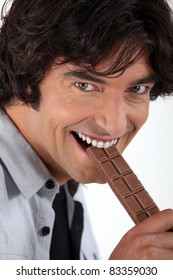 Man Eating Chocolate Bar