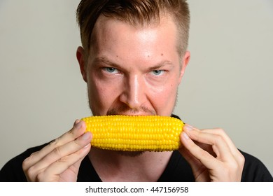 Man eating corn