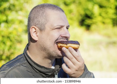 Man Eating Donuts