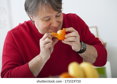 Man Eating Fruit