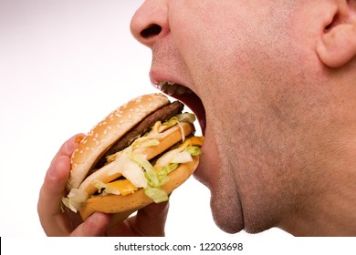 Man Eating Hamburger Over White