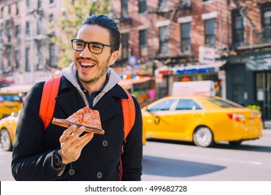 Man Eating A Pizza Slice In New York