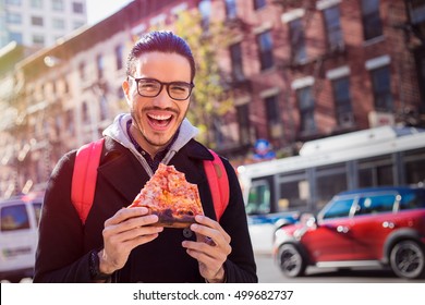 Man Eating A Pizza Slice In New York