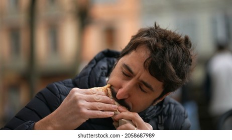 Man Eating Sandwich Outside Feeling Pleasure. Person Eat Food Snack Outdoors