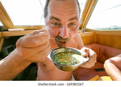 Man Eating A Soup