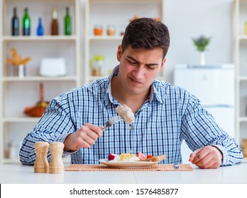 Man Eating Tasteless Food At Home For Lunch